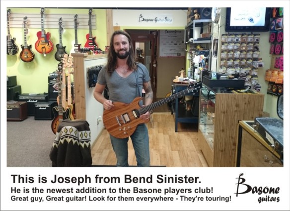 Vancouver's Bend Sinister guitar player with his Basone